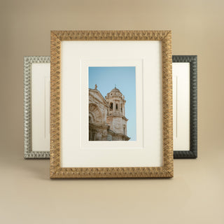 gold, grey and silver frames on a beige background