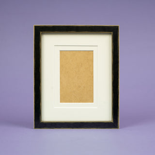 Black modern picture frame on light purple background portrait with two mounts