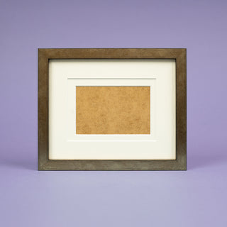 worn bronze landscape picture frame with two off white mounts