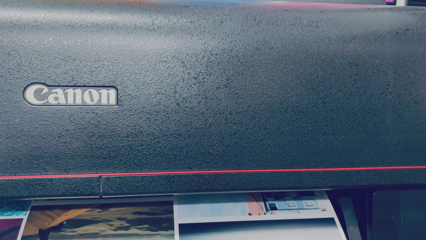 Canon printer printing photo images on a roll of 290 gsm lustre paper. 